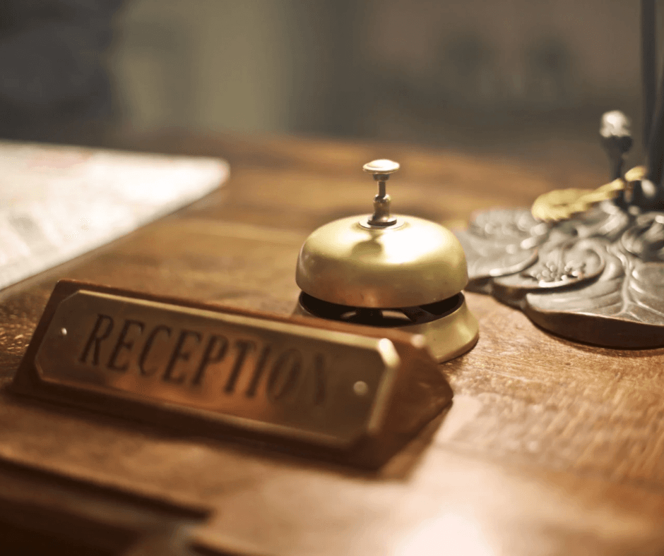 Image of a reception desk, with a call bell